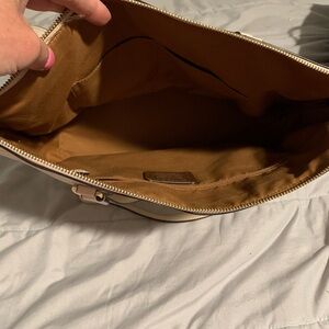 White/cream tote bag with a zipper pouch inside